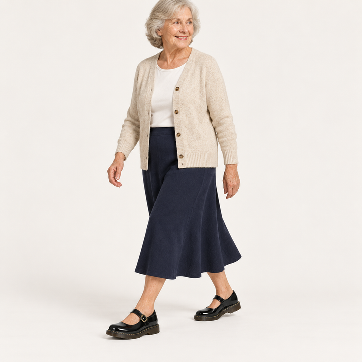 Bianca black Mary Jane shoes worn by a mature woman, walking view