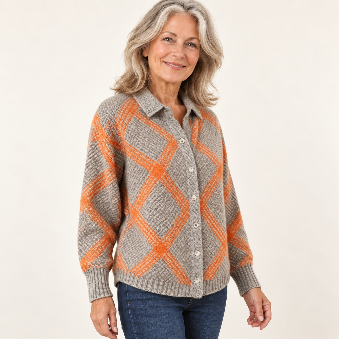 Mature British woman wearing the CHRISTELLE checked blouse in a three-quarter studio view