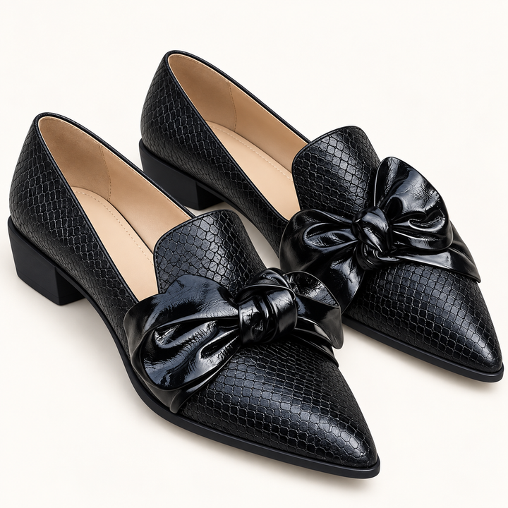 Elena black bow shoes isolated front three-quarter view