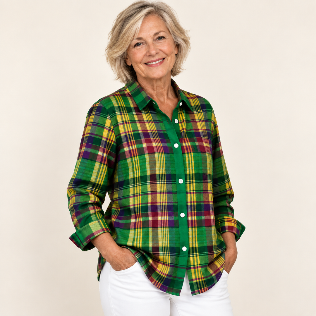 Mature British woman wearing the ELINDRA checked blouse in a three-quarter studio view