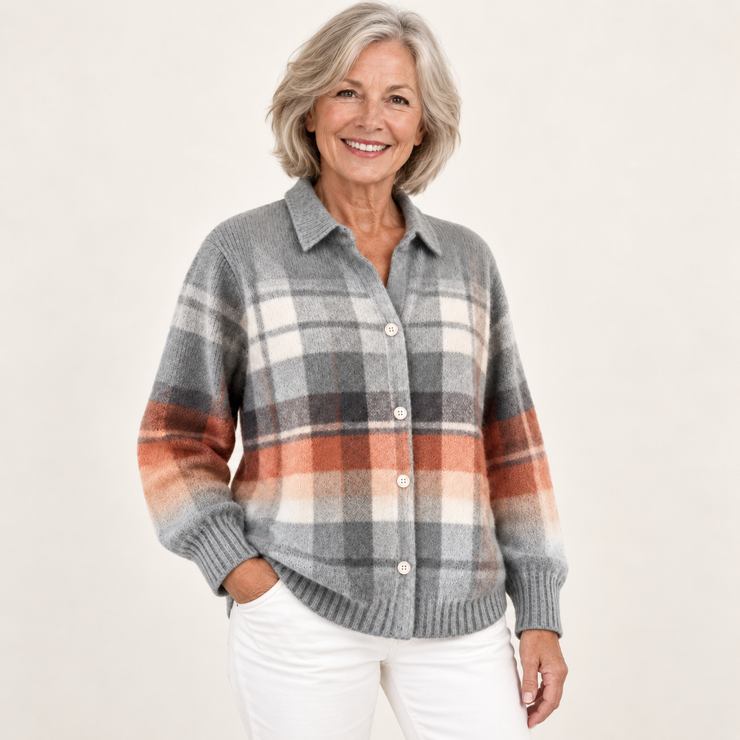 Mature British woman wearing the ELIRA checked blouse in a three-quarter studio view