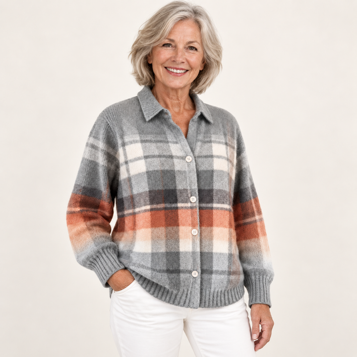 Mature British woman wearing the ELIRA checked blouse in a three-quarter studio view