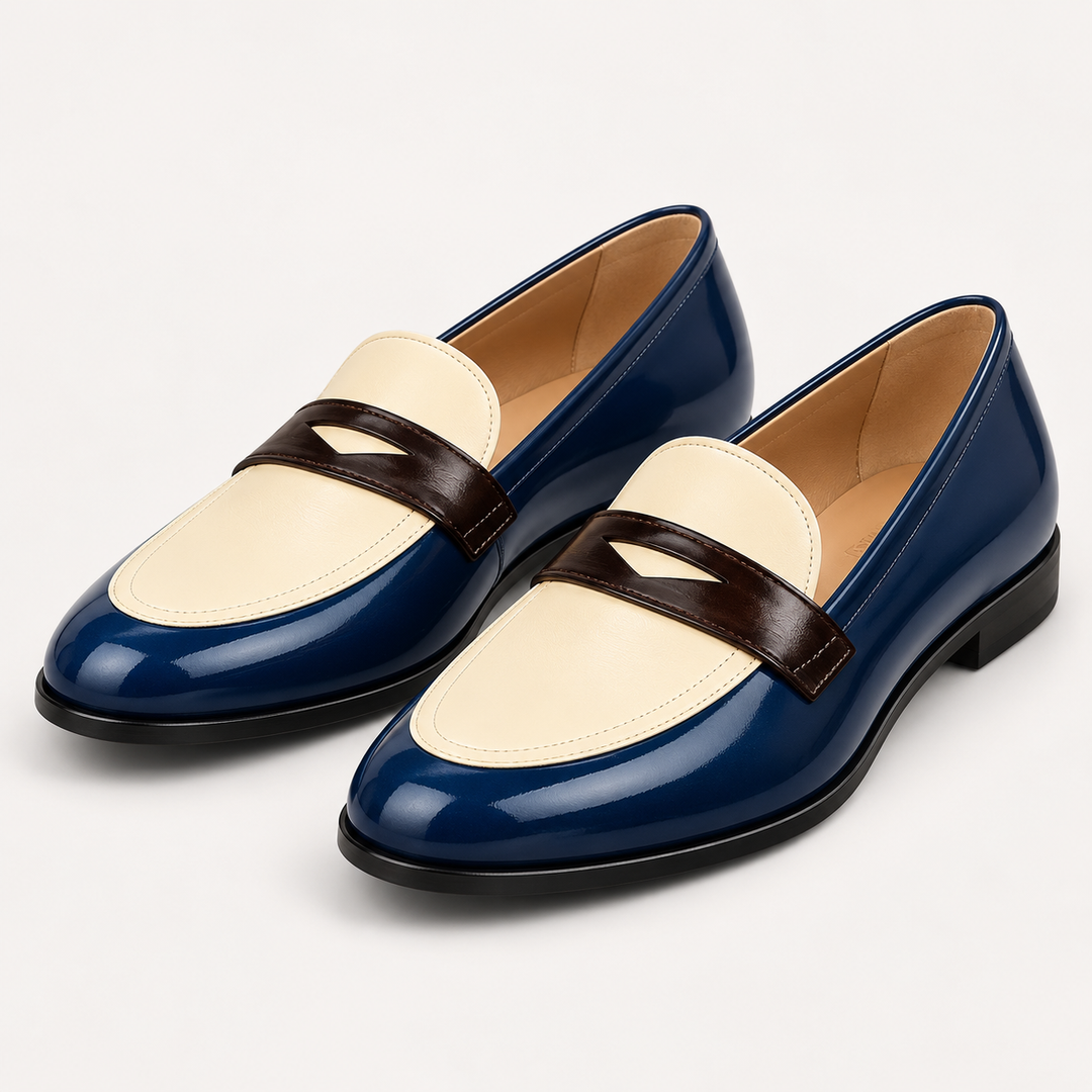 Elisa navy cream and brown loafers, isolated front three-quarter