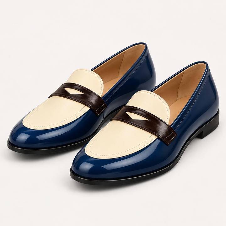 Elisa navy cream and brown loafers, isolated front three-quarter
