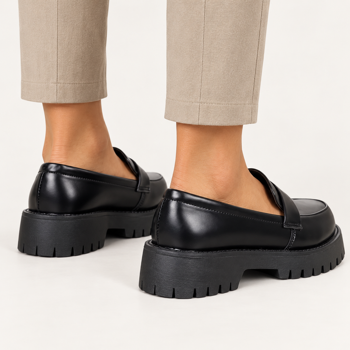 Giada black platform loafers worn, clean studio rear view
