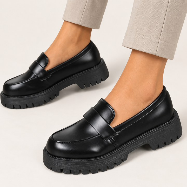 Giada black platform loafers worn, clean studio three-quarter view