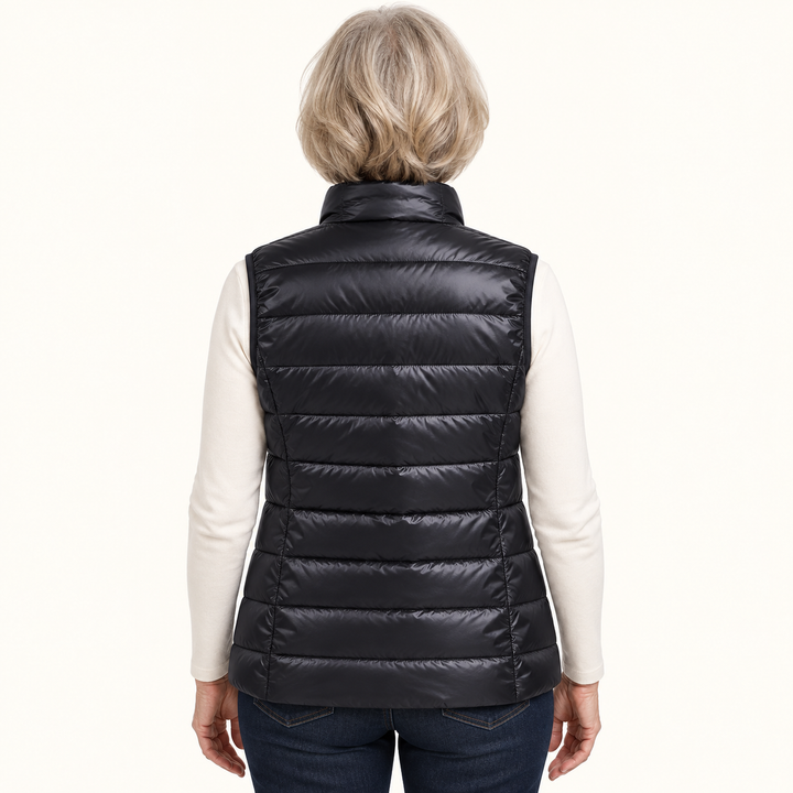 ISA Black padded gilet on mature model, back view