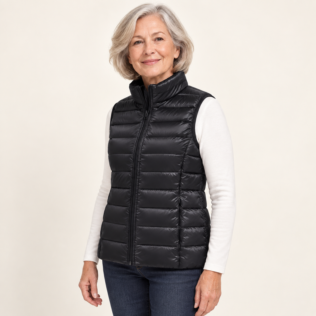 ISA Black padded gilet on mature model, three-quarter view