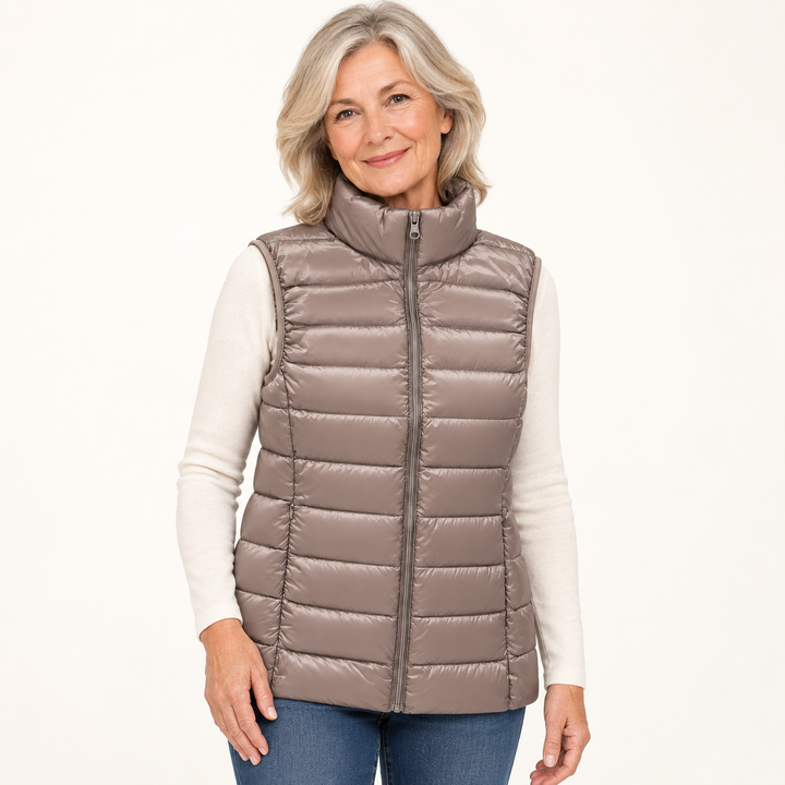 ISA Champagne padded gilet on mature model in clean studio
