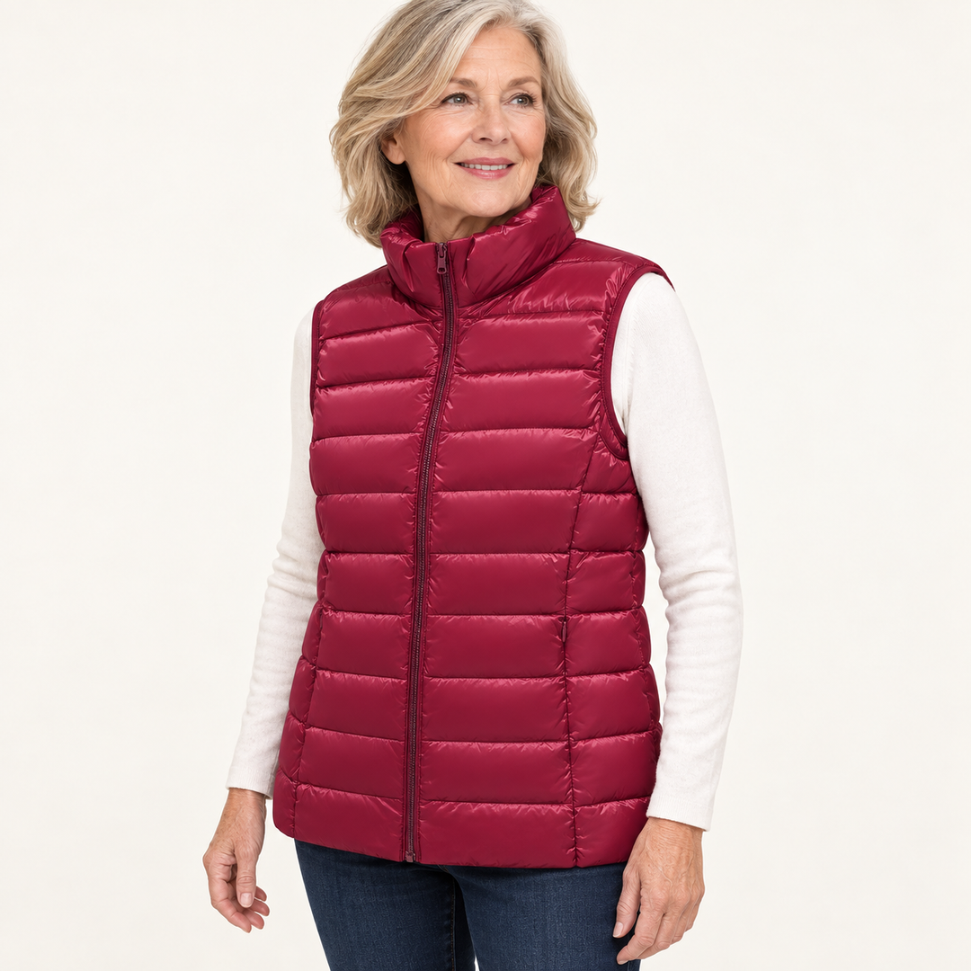ISA Dark Red padded gilet on mature model, three-quarter view