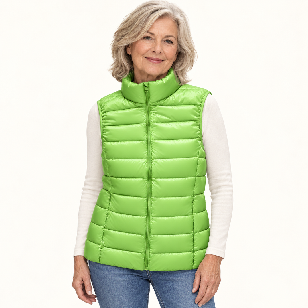 ISA Green padded gilet on mature model in clean studio
