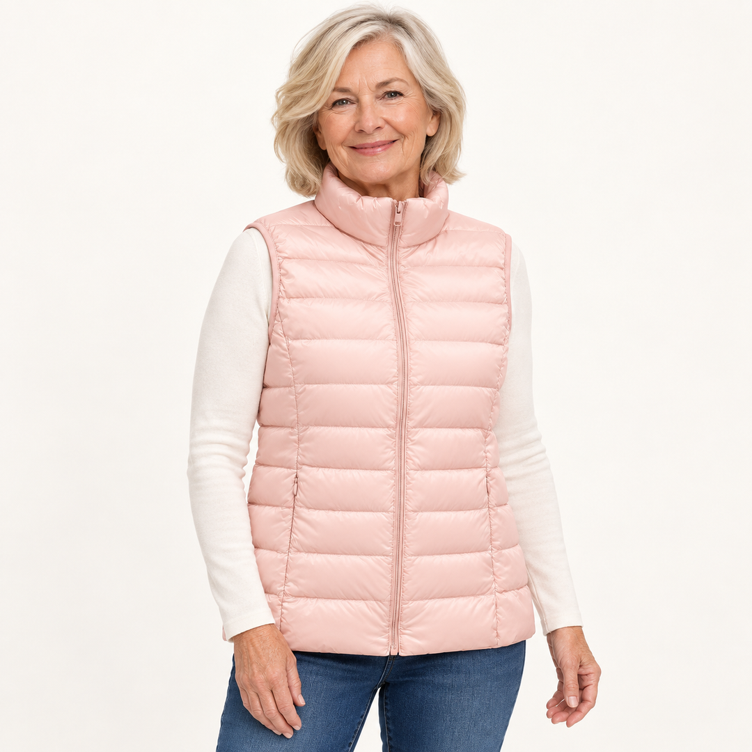 ISA Light Pink padded gilet on mature model in clean studio