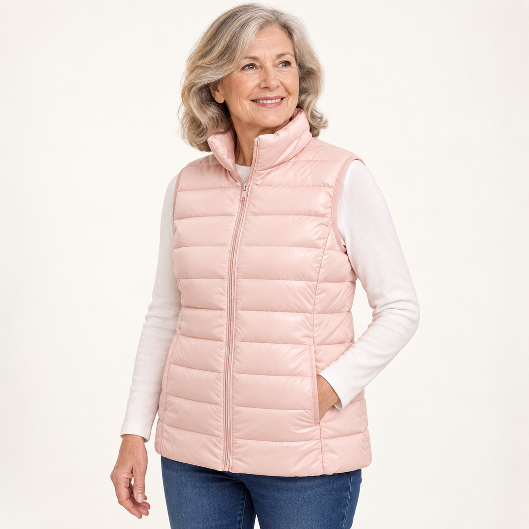 ISA Light Pink padded gilet on mature model, three-quarter view