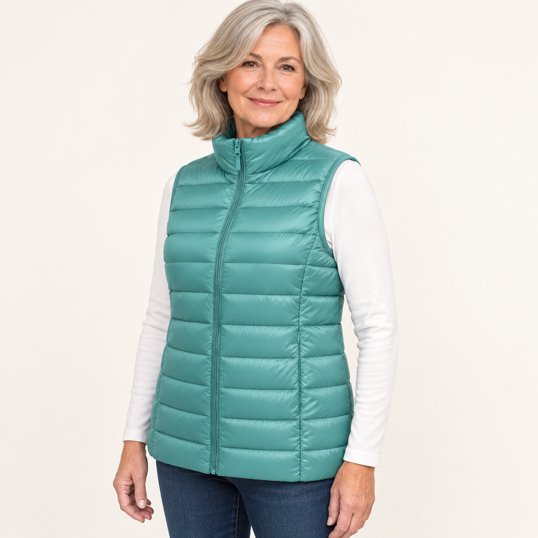 ISA Mint Green padded gilet on mature model, three-quarter view