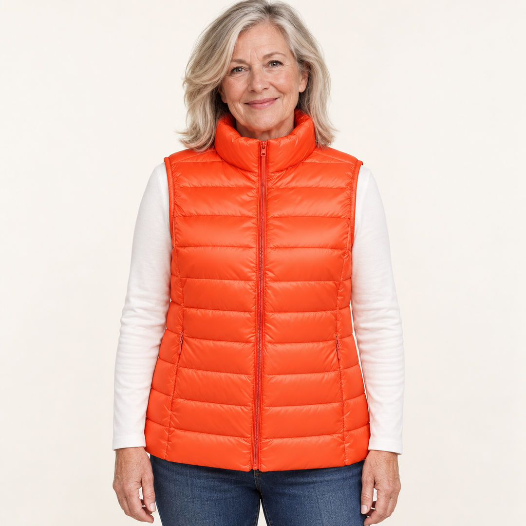 ISA Orange padded gilet on mature model, front view