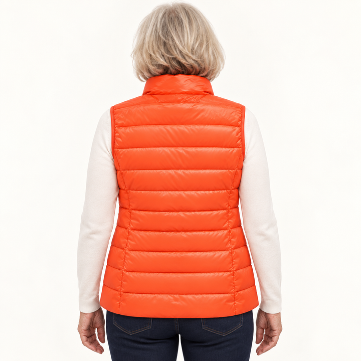 ISA Orange padded gilet on mature model, back view