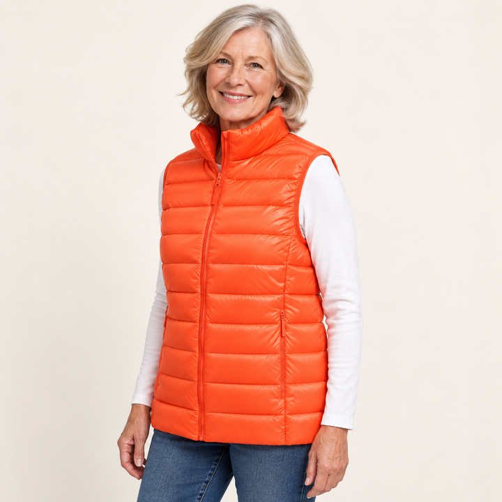 ISA Orange padded gilet on mature model, three-quarter view