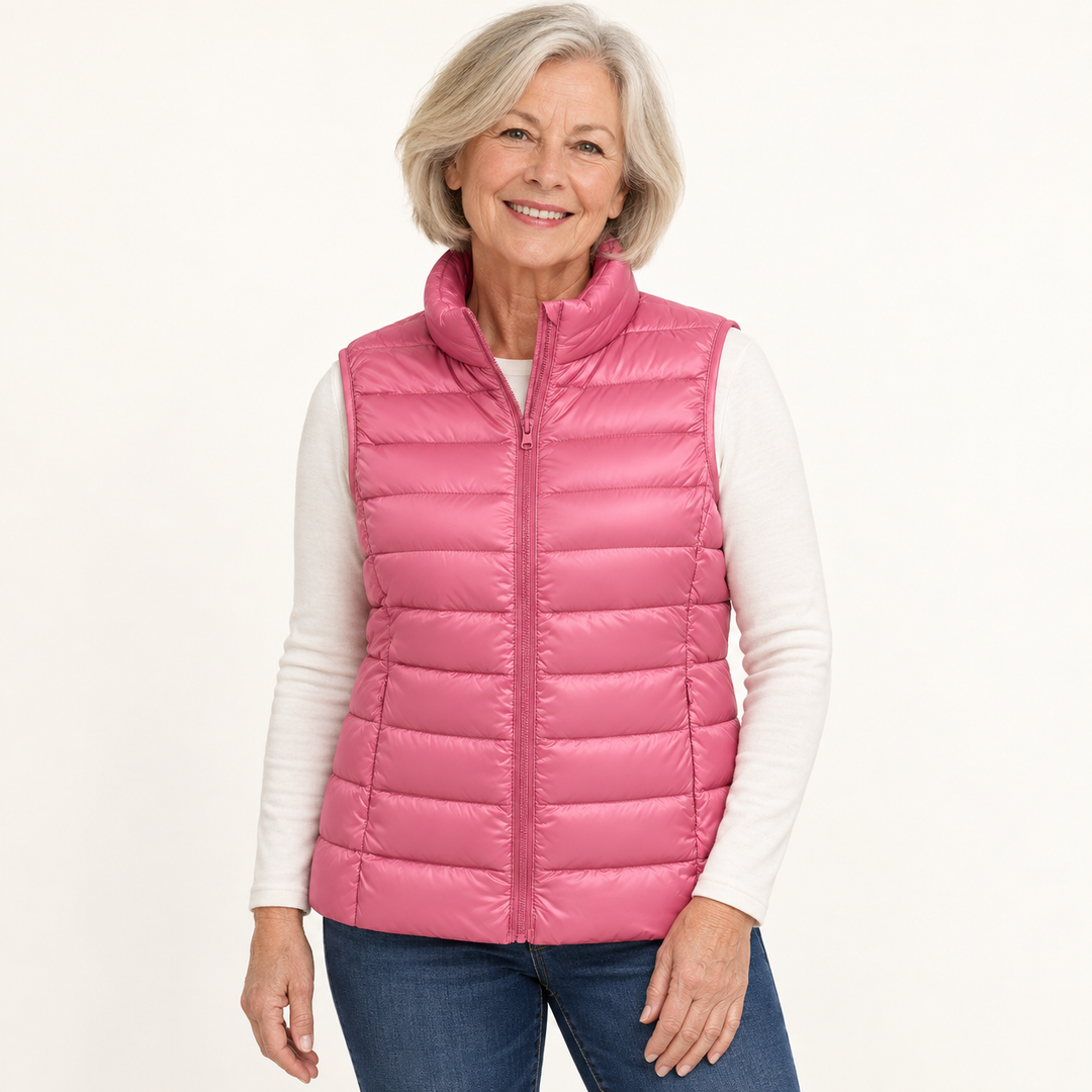 ISA Salmon padded gilet on mature model in clean studio