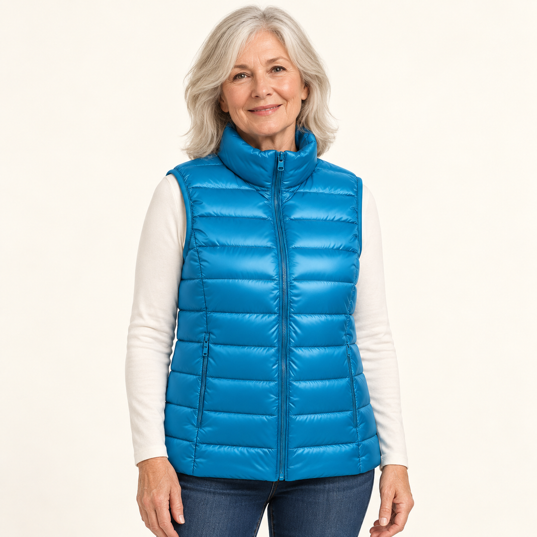 ISA Sky Blue padded gilet on mature model in clean studio