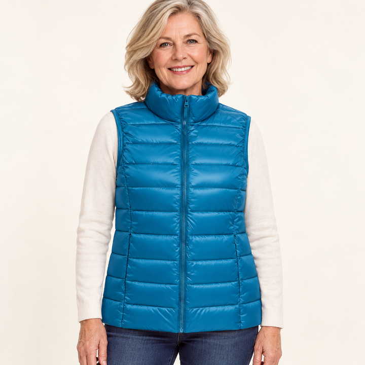 ISA Sky Blue padded gilet on mature model, front view