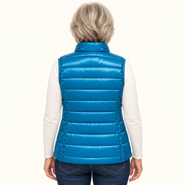 ISA Sky Blue padded gilet on mature model, back view