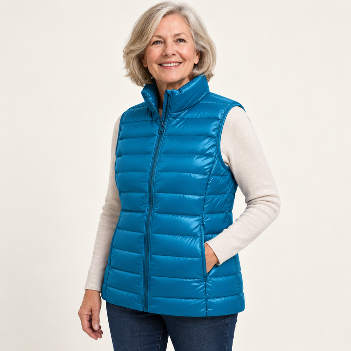 ISA Sky Blue padded gilet on mature model, three-quarter view