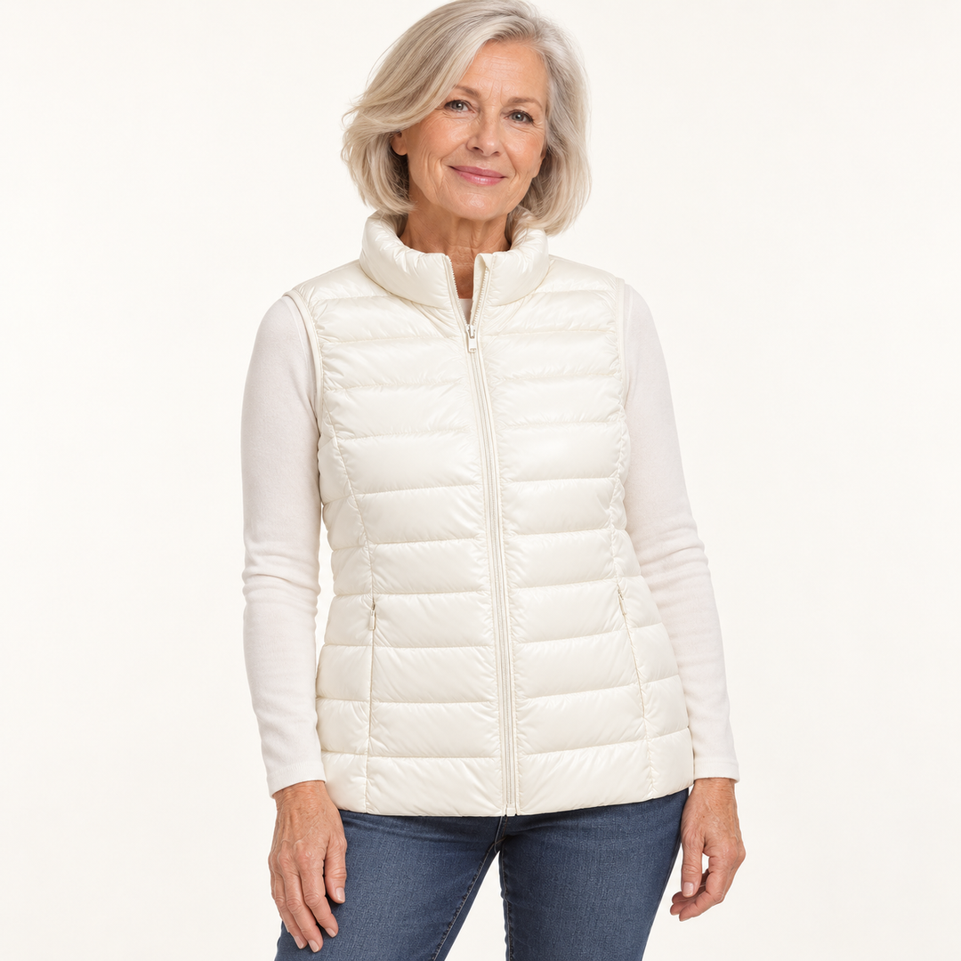 ISA White padded gilet on mature model in clean studio