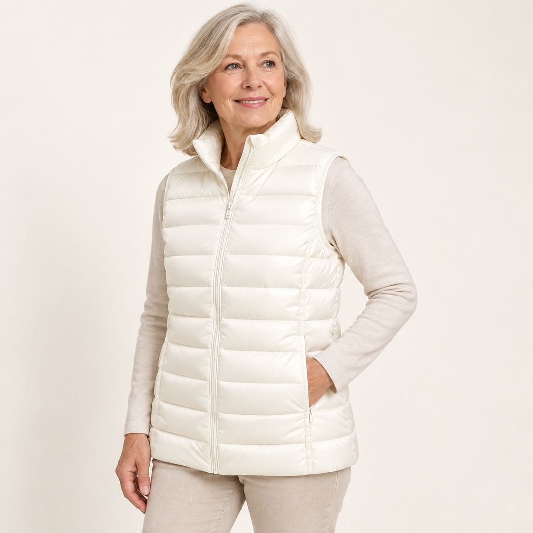 ISA White padded gilet on mature model, three-quarter view