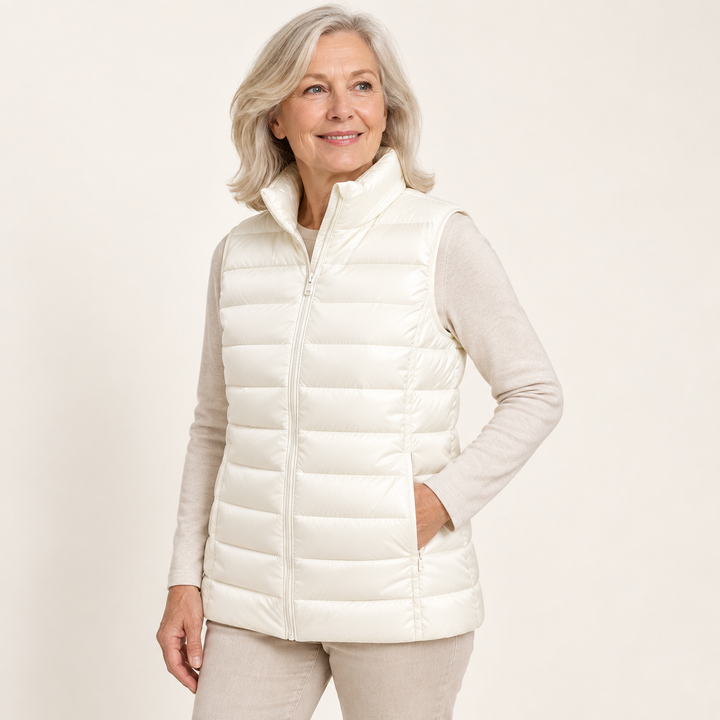 ISA White padded gilet on mature model, three-quarter view