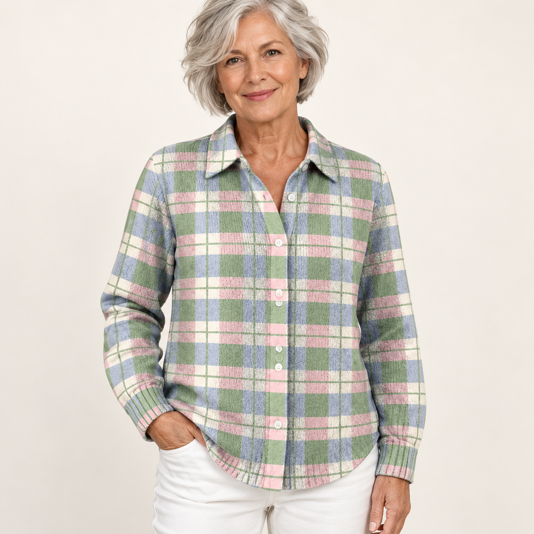 Mature British woman wearing the LENORA blouse on a clean warm off-white studio background
