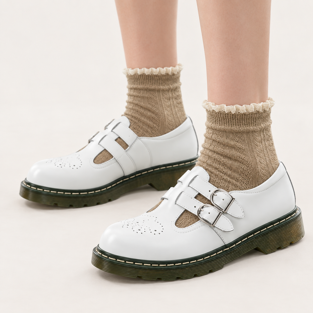 Luna white double-buckle shoes worn, clean studio three-quarter view