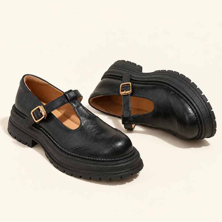 Black T-strap Mary Jane shoes, clean studio isolated view