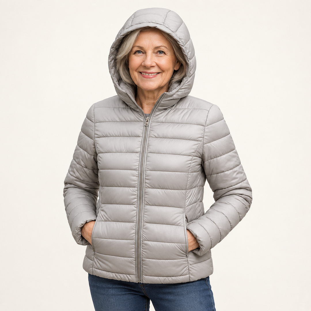 METTA Grey padded jacket on mature model in clean studio