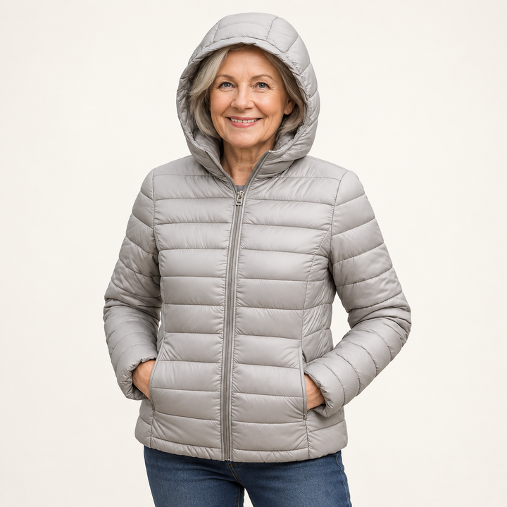 METTA Grey padded jacket on mature model in clean studio