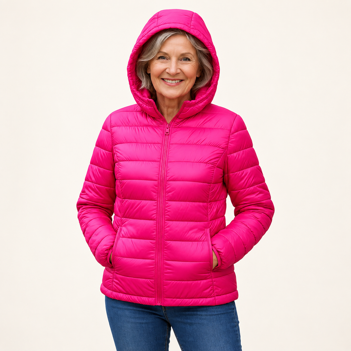 METTA Hot Pink padded jacket on mature model in clean studio