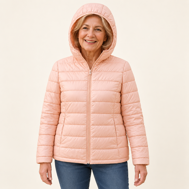 METTA Light Pink padded jacket on mature model in clean studio
