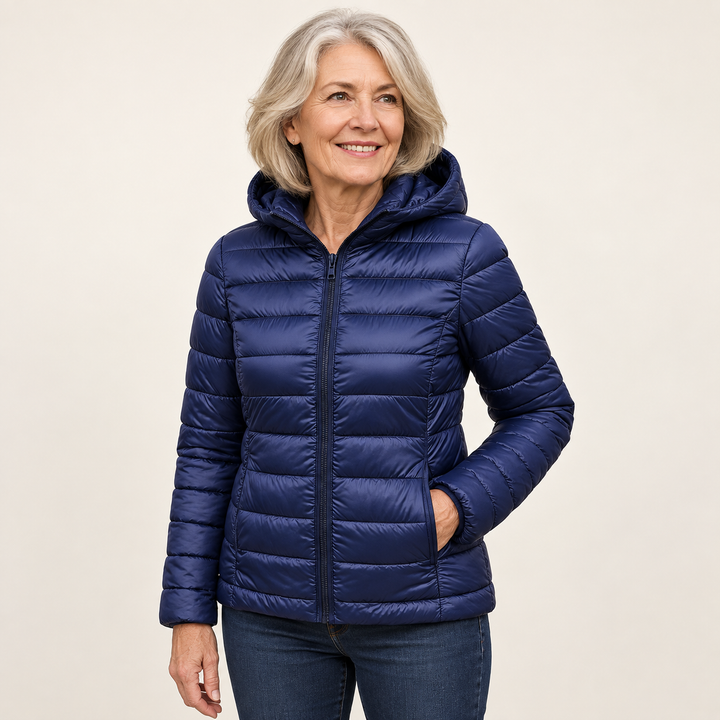 Metta transitional padded jacket in navy blue — mature model three-quarter view
