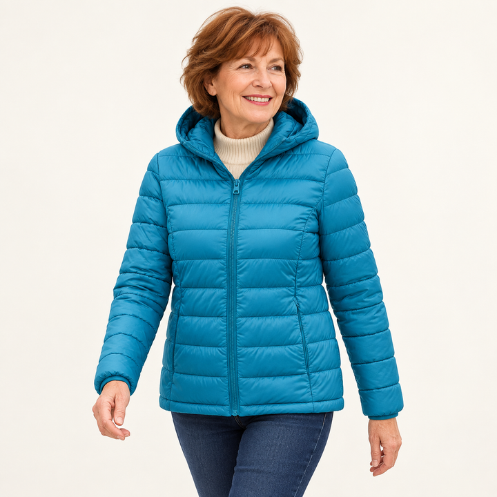 Metta transitional padded jacket in ocean blue — mature model natural pose