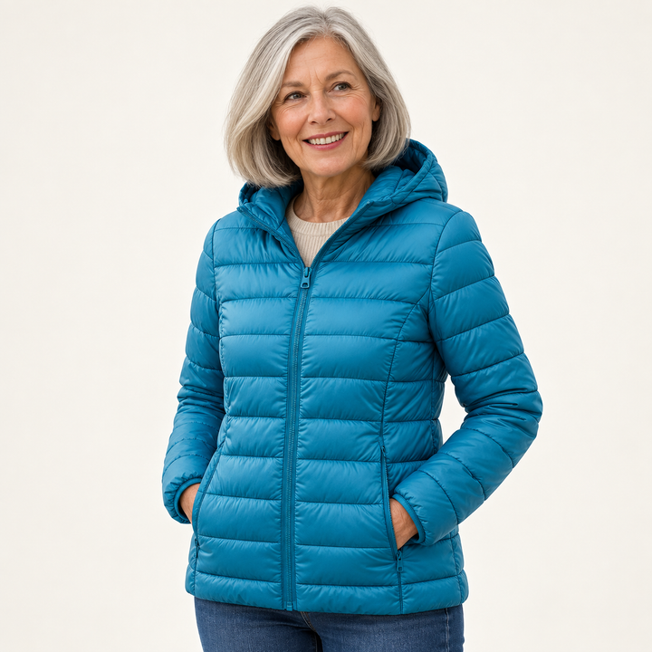 Metta transitional padded jacket in ocean blue — mature model three-quarter view