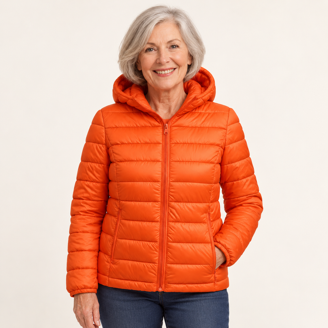 Metta transitional padded jacket in orange — mature model front view