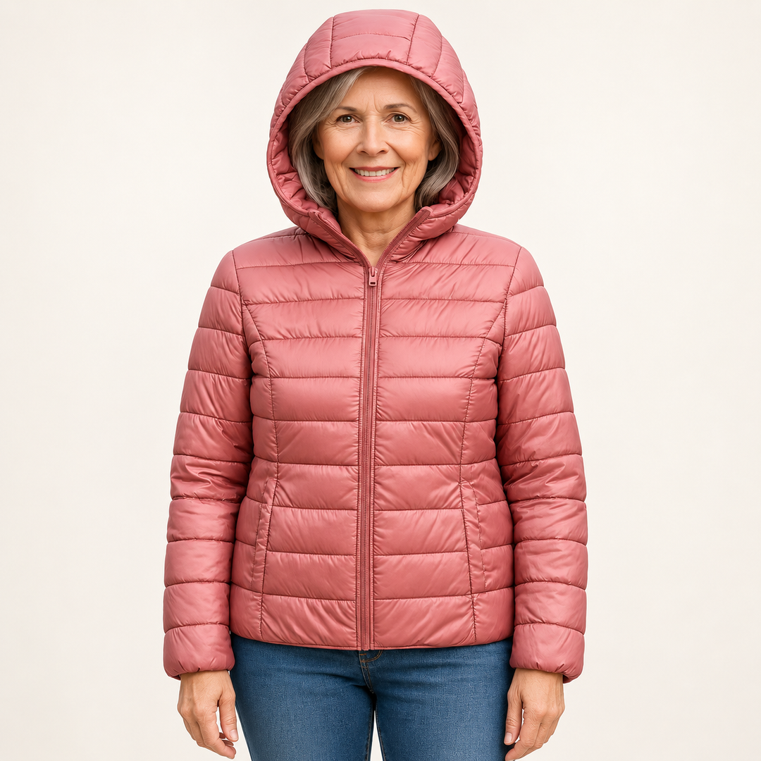 Metta transitional padded jacket in salmon pink — mature model front view