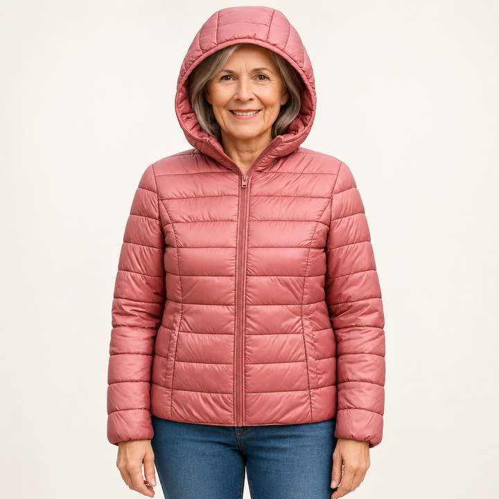 Metta transitional padded jacket in salmon pink — mature model front view