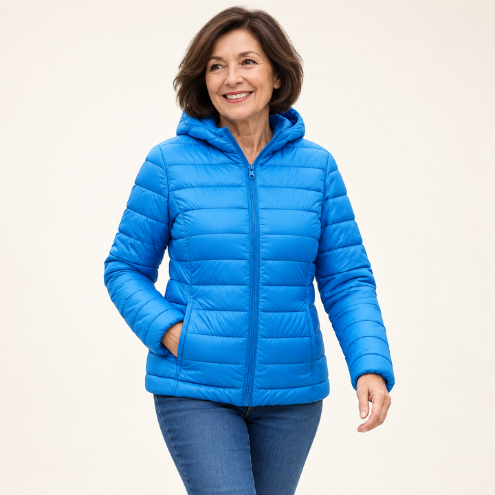Metta transitional padded jacket in sky blue — mature model natural pose