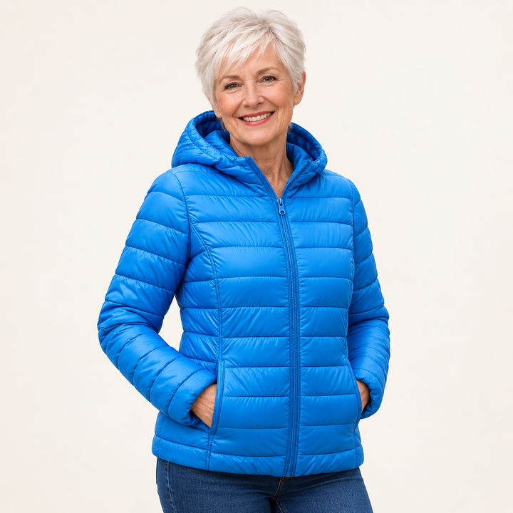 Metta transitional padded jacket in sky blue — mature model three-quarter view