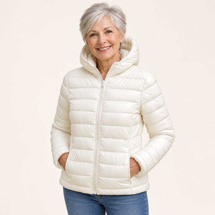 Metta transitional padded jacket in white — mature model natural pose