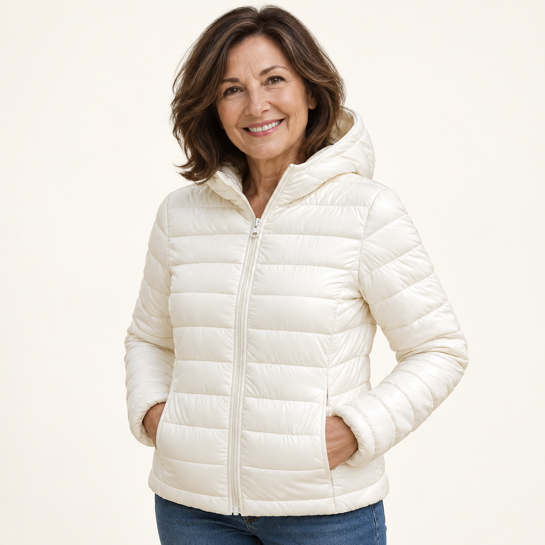 Metta transitional padded jacket in white — mature model three-quarter view