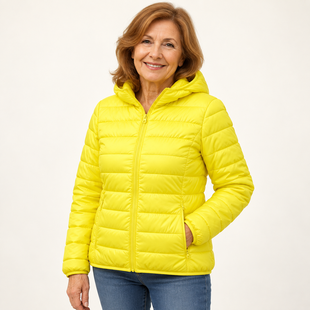 Metta transitional padded jacket in yellow — mature model natural pose