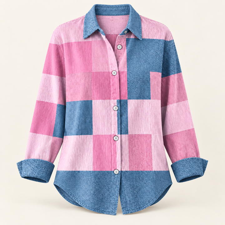 NORAYA pink and blue colour-block blouse isolated on a clean warm off-white background