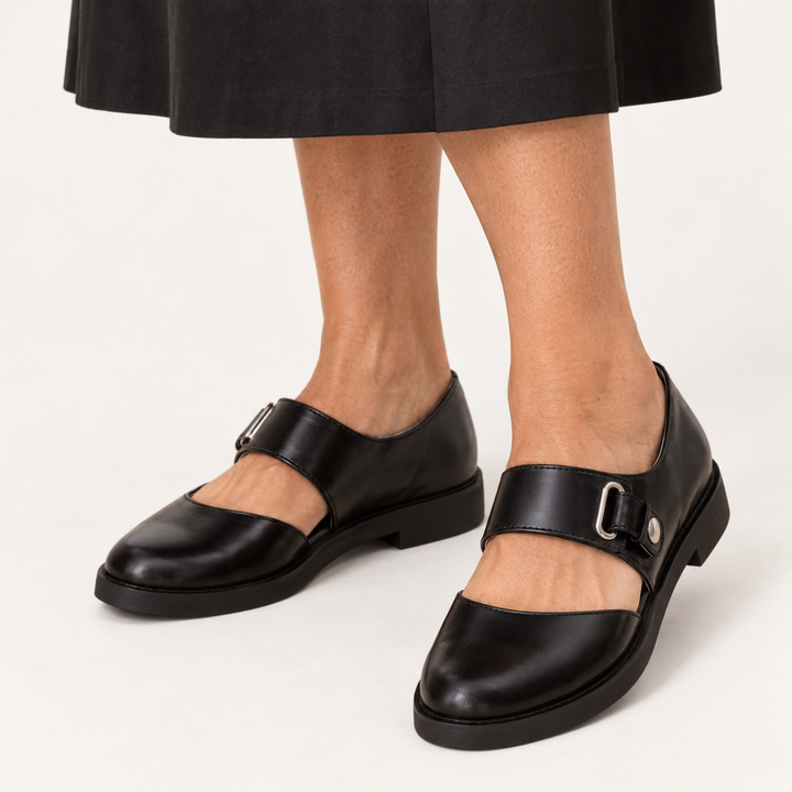 Sofia black wide strap Mary Jane shoes worn front three-quarter view