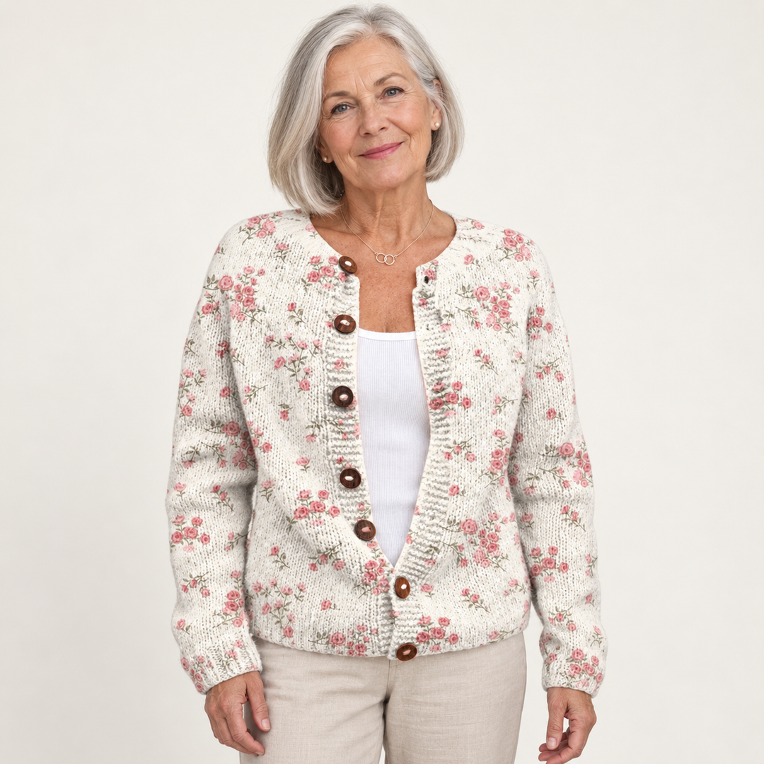 Evanthea | Knitted cardigan with tortoiseshell buttons and rose pattern worn by a mature woman on a clean background